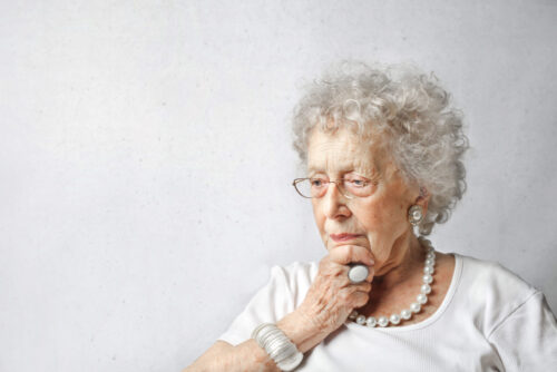 elderly woman thinking